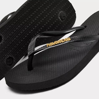 HAVAIANAS Black Logo Metallic Flip Flops in Golden