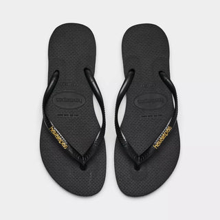 HAVAIANAS Black Logo Metallic Flip Flops in Golden
